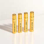 Korbaj Parfum Prestige Collection 4-piece Extrait de Parfum sample set with gold Oud For You, Scarlet Amber, Jade Royale and Rose Sands sample bottles.