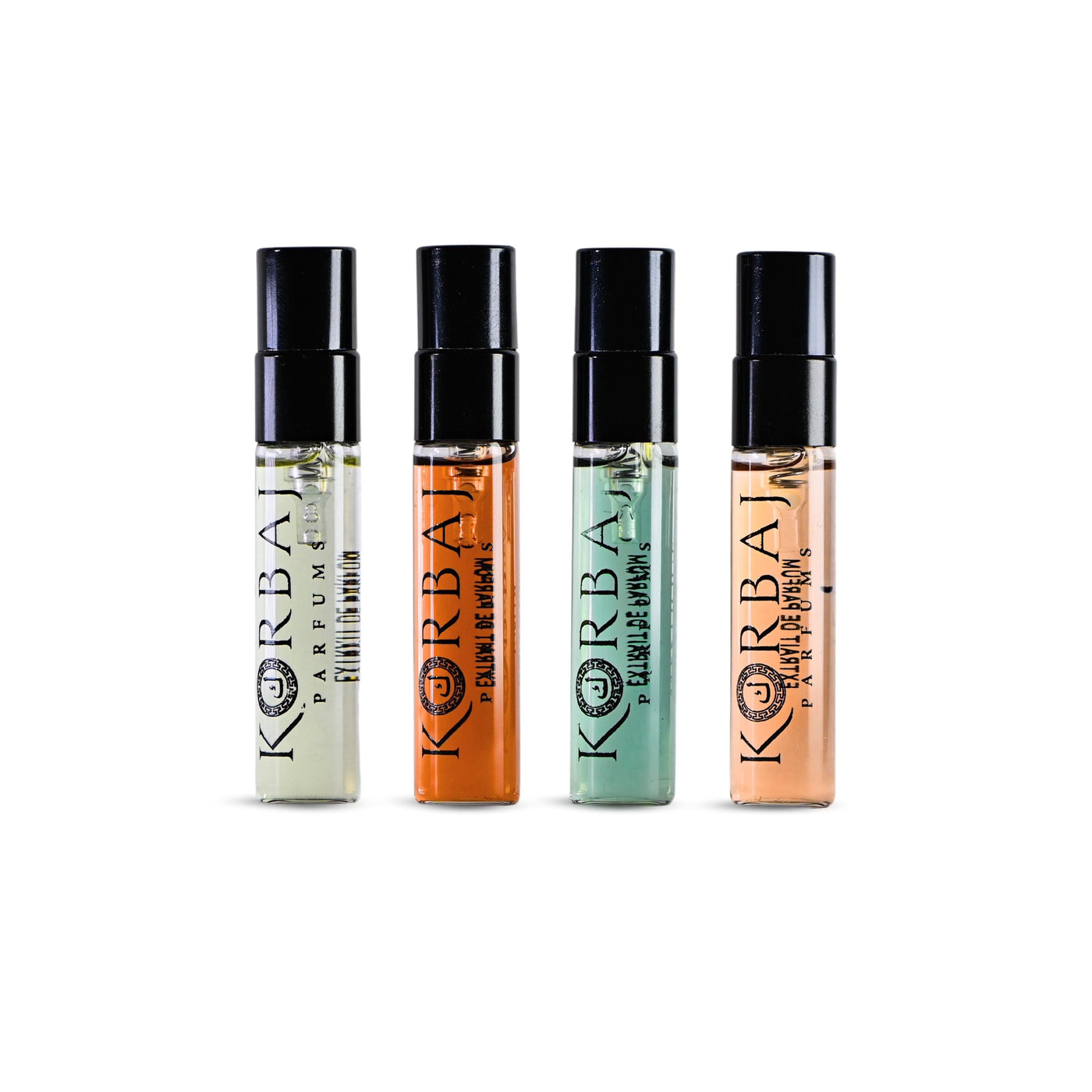 Front view of four Korbaj Discovery perfume samples in black-capped sprays: Musky Signature, Toxic Desire, Emir and Mystique.