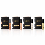 Korbaj Original Collection Discovery set perfume samples, with miniature sprays lined up beside four fragrance boxes on white.